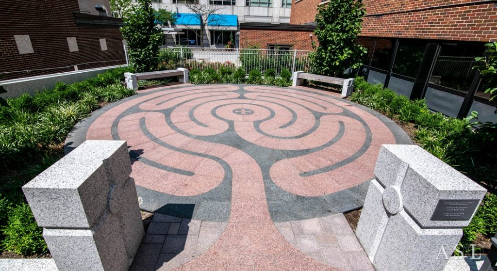 Our contributions to this excellent remake of a loading zone were numerous granite elements, including a water runnel, seating with wood, a beautiful labyrinth done in granite paving.